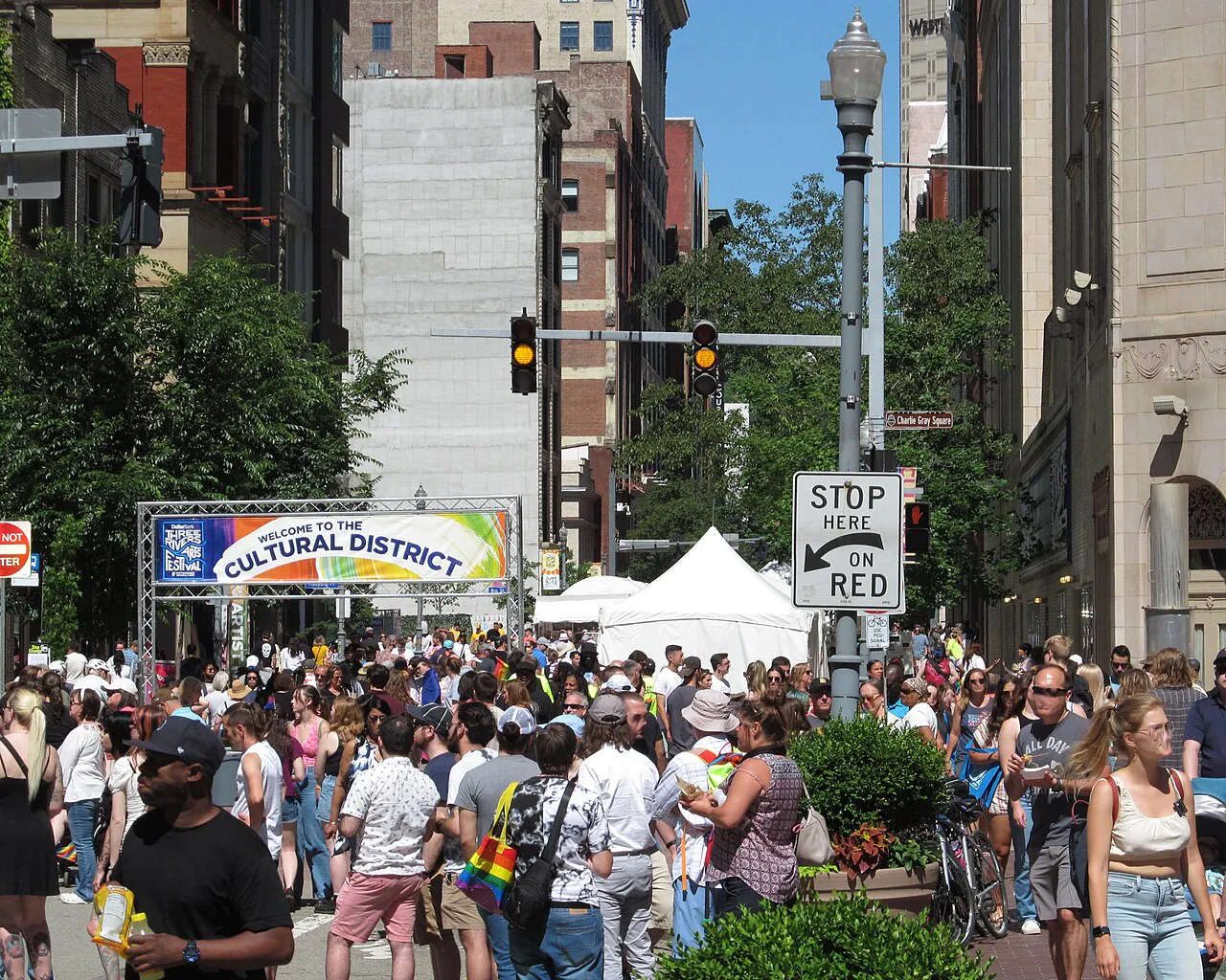Crowds walking among tents at the Three Rivers Arts Festival in Pittsburgh