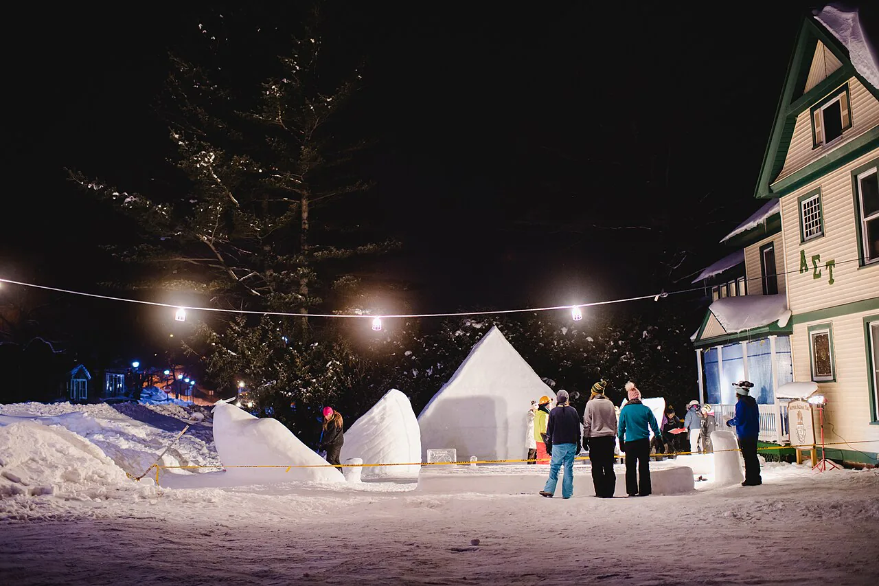 Visitors viewing snow statues at Michigan Tech Winter Carnival in Houghton Michigan