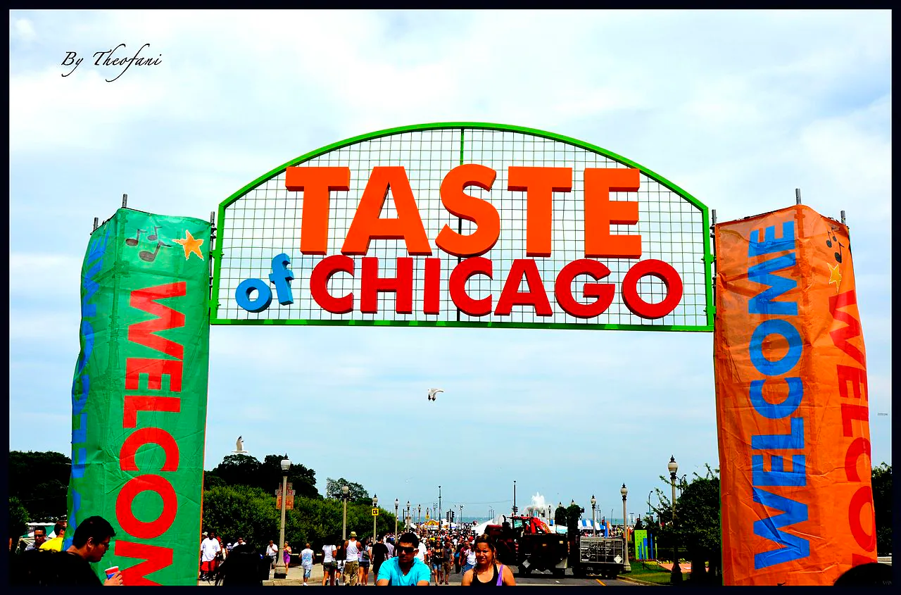 Taste of Chicago entrance arch with festival visitors in Grant Park